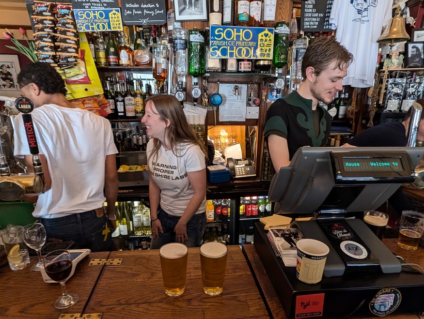 Staff laughing behind the bar