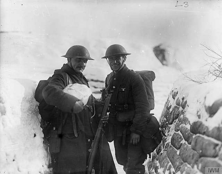 Two soldiers in the first world war in a frozen trench