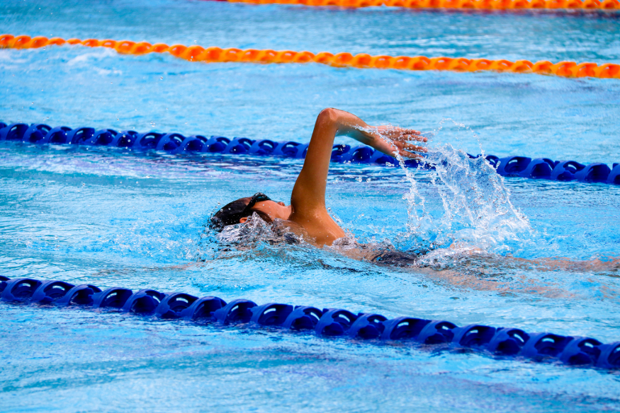 Swimming pools open on Christmas Day: A woman swimming front crawl in a swimming pool