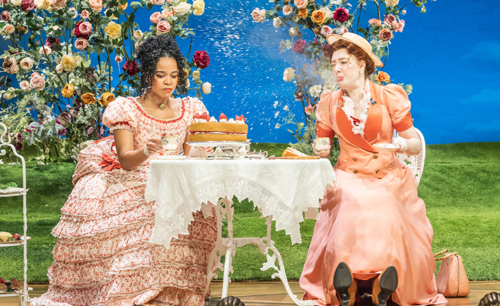 What's on in London this weekend: two actors in period costumes sitting at a table with tea and cake