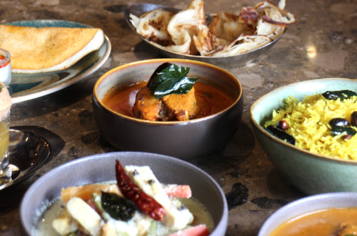 Things to do in London Christmas week: a selection of Indian dishes on a table