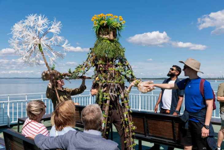 A Green Man type character on a ferry