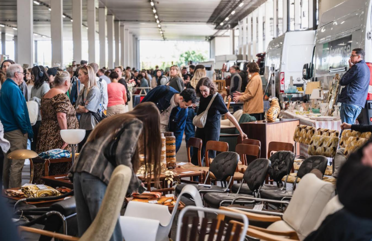 What's on in London this weekend: people looking at chairs for sale at the Giant London Flea
