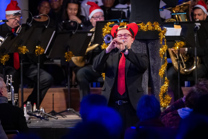 What's on in London this weekend: a brass band performing, wearing Santa hats and decorated with tinsel