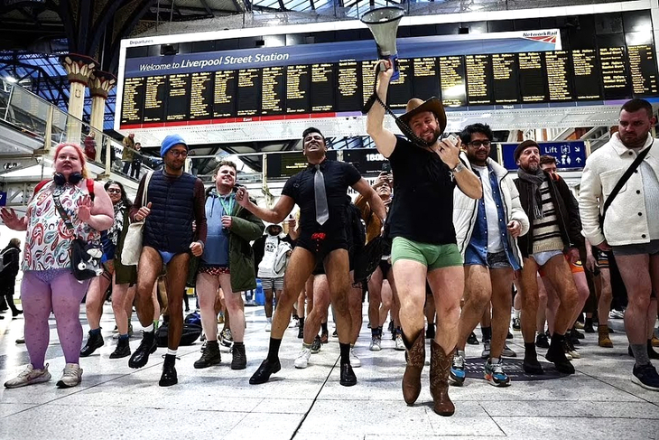 What's on in London this weekend: people taking part in the No Trousers Tube Ride at Liverpool Street station