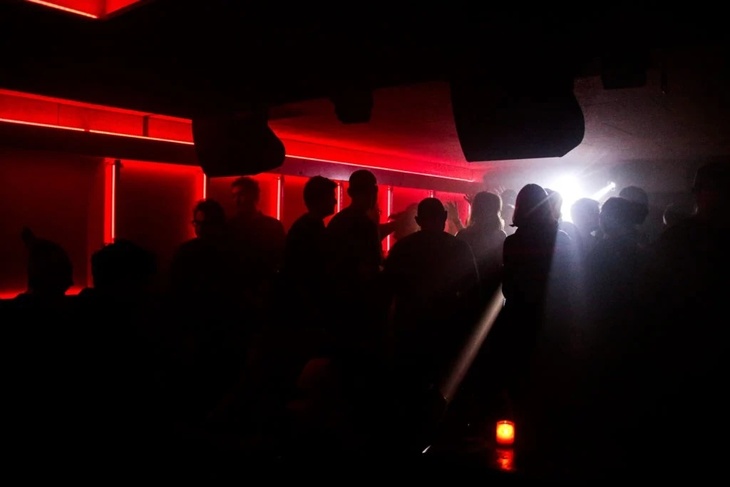 People dancing in the dark at the Social