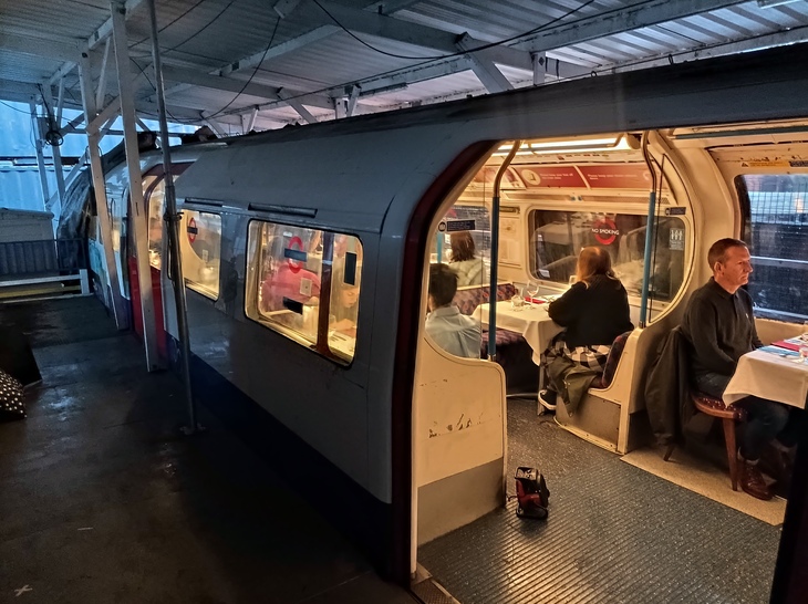London museums: People dining on a Tube carriage