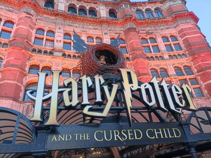 The frontage of the Palace Theatre, with Harry Potter signage