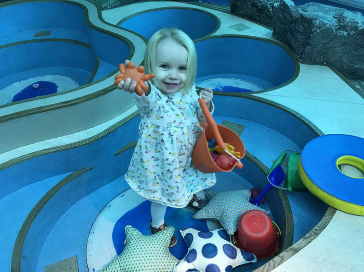 Free museums: A small girl with maritime related toys