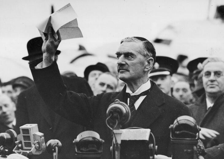 Neville Chamberlain waving a piece of paper