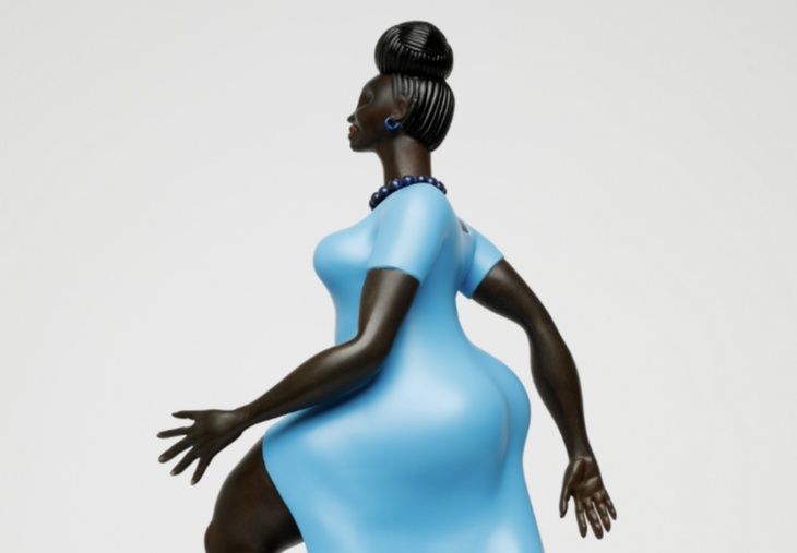 Sculpture of a Black woman in a blue dress