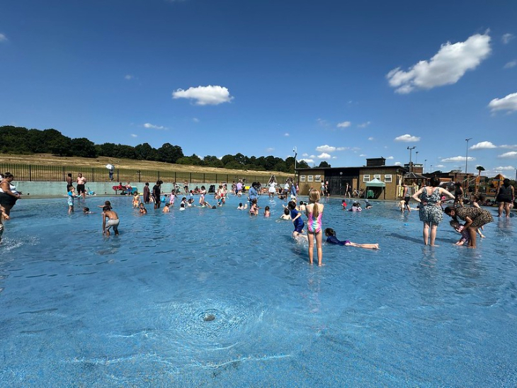 What's on in London Summer 2026:  people playing in an outdoor paddling pool on a sunny day