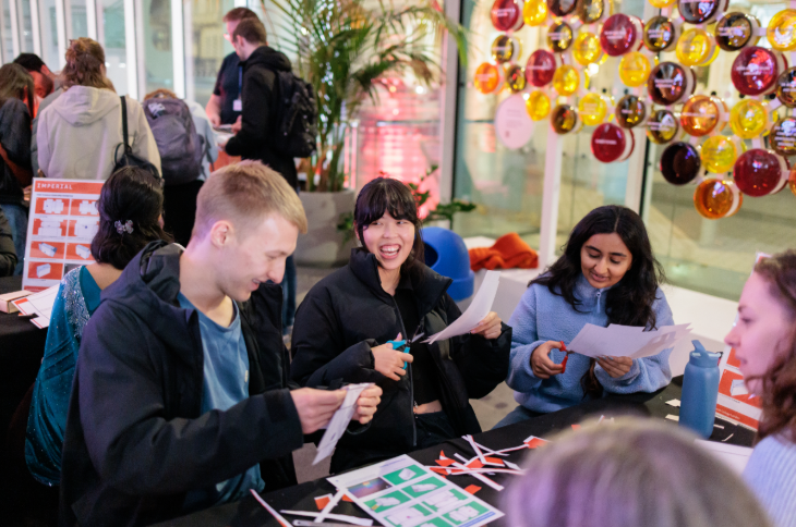 Free events in London: adults sitting chatting around a craft table
