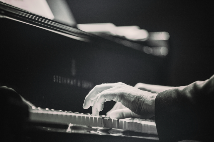 Free events in London this week: a black and white photo of a pair of hands playing a piano