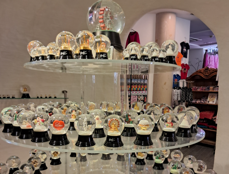 Visit Vienna: a display of snow globes in a shop