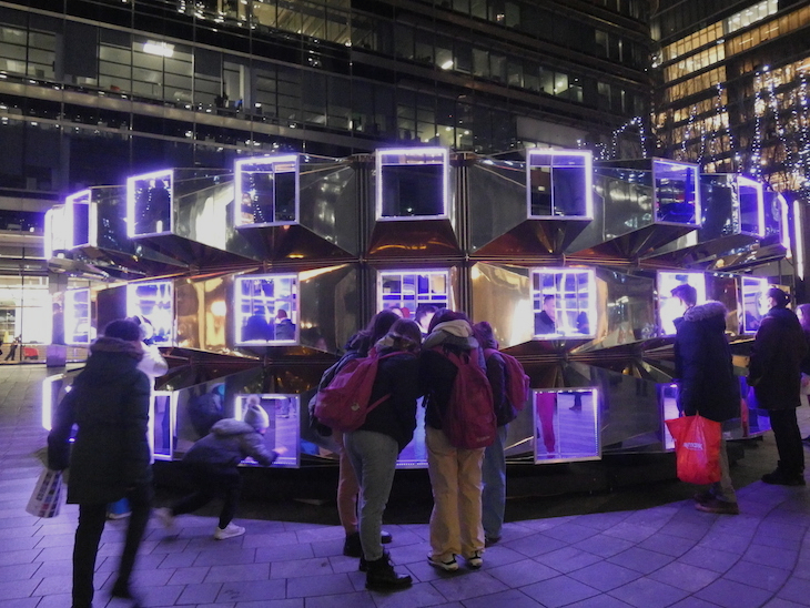 Things to do in London today: people viewing squares of light, an installation at a previous Canary Wharf Winter Lights