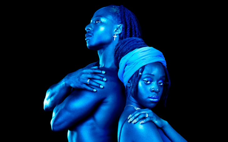 Best events in London in February 2026: two people standing back to back, tinged in a blue light