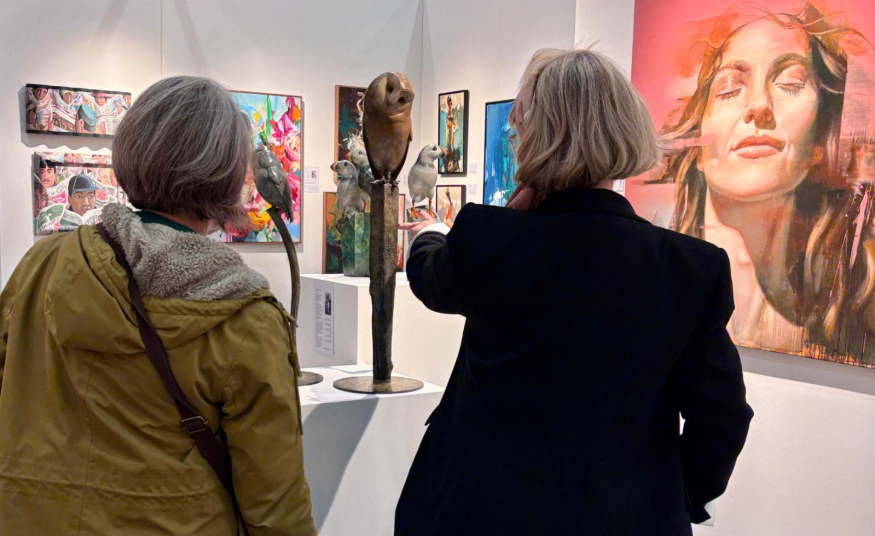 Things to do in London this weekend: two women viewing a sculpture at an art fair