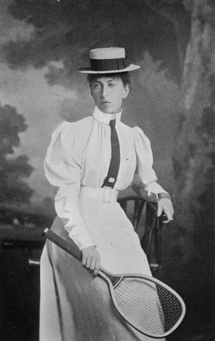 A woman in old tennis garb