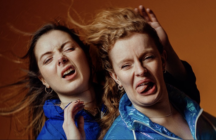 Tow women having their hair unceremoniously blown