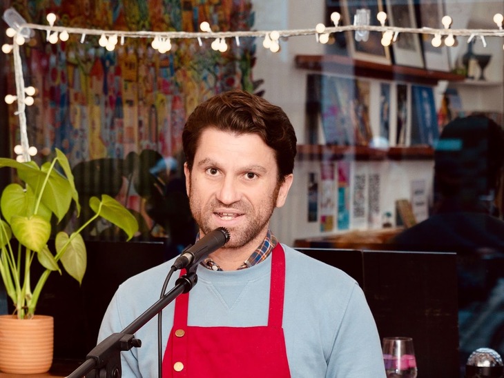 A man in front of a mic