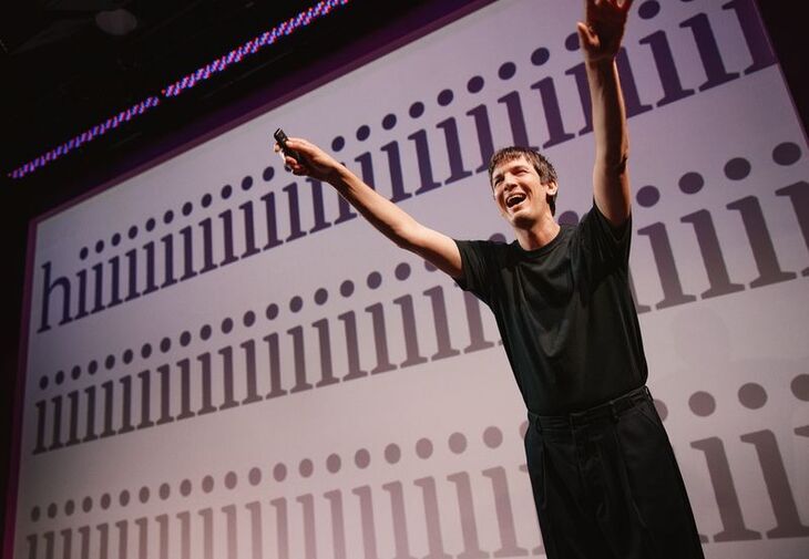 Josh Sharp with his arms aloft