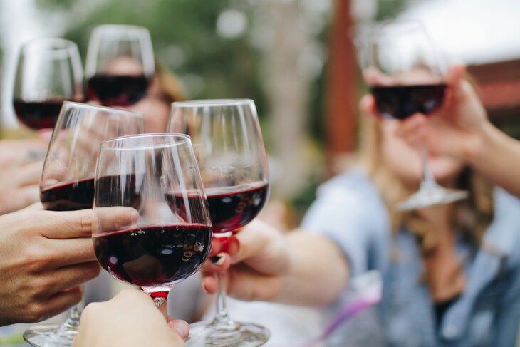 Wine glasses being clinked