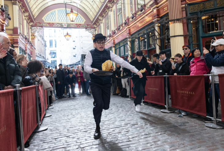 A man racing with a pancake
