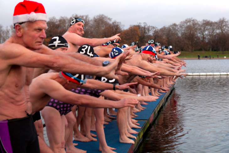Swimmers about to dive in