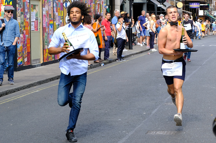 Two waiters running
