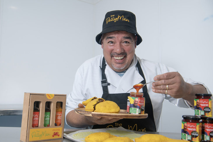 A man with patties and chutney