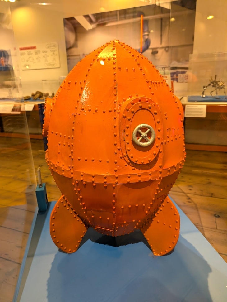 A bright orange rocket ship