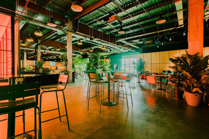 Best events in London today: the interior of a bar/restaurant, featuring high tables with bar stools and an industrial ceiling