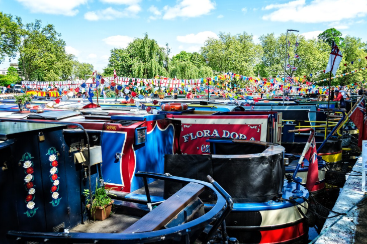 Canalway Cavalcade Little Venice 2026: bunting strung above a group of canalboats moored up together