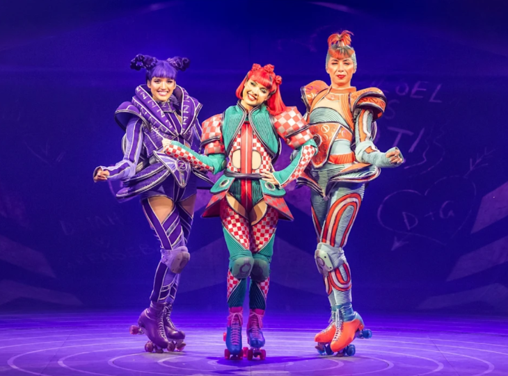 Family-friendly theatre shows London:  three performers on roller skates in colourful costumes
