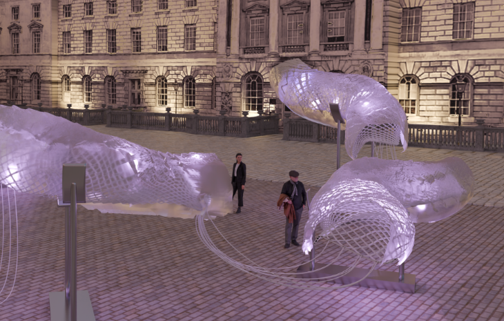 Free things to do in London: two people looking at a large, ethereal snake installation in the courtyard at Somerset House