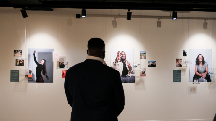 Top events in London today: a person looking at photographs on a gallery wall