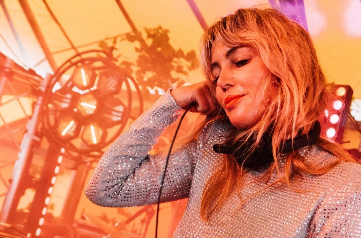 What's on in London this weekend: DJ Carly Foxx holding headphones to her ears