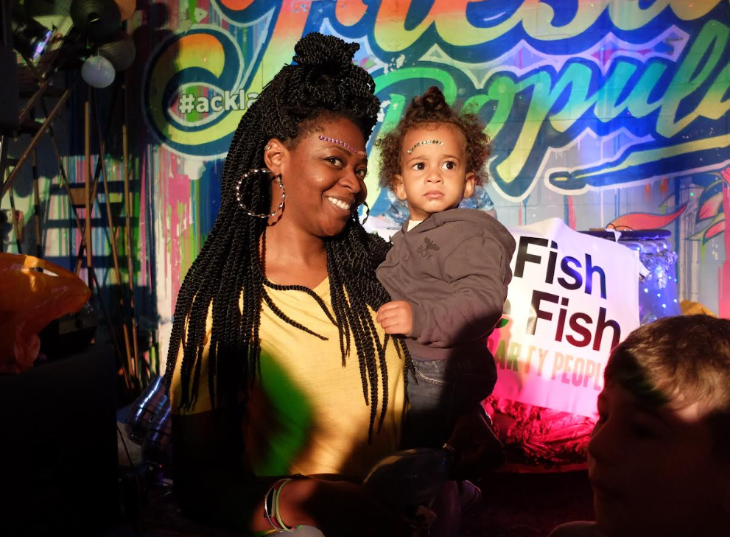 Top events in London today: a woman holding a toddler