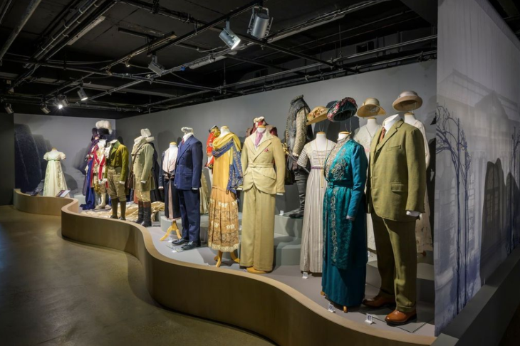 Top things to do in London today: a row of mannequin wearing costumes inside the Fashion & Textile Museum