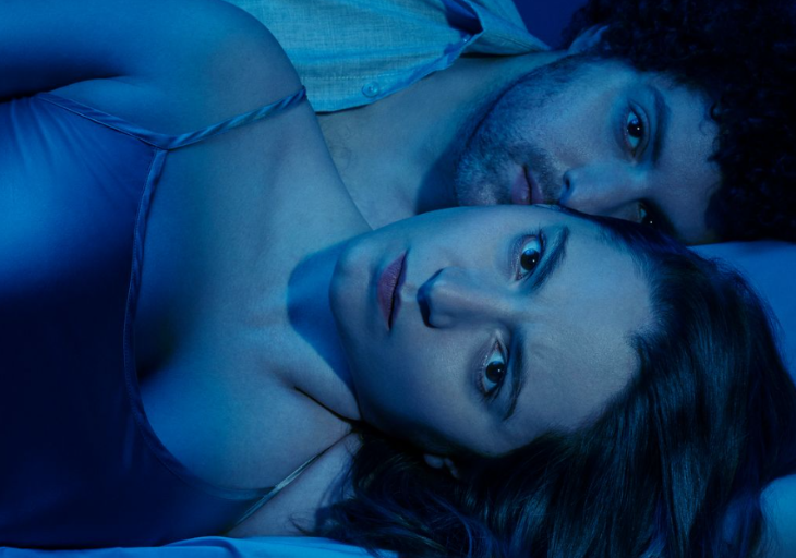Best events in London today: a man and woman laying next to each other, bathed in blue light and looking at the camera