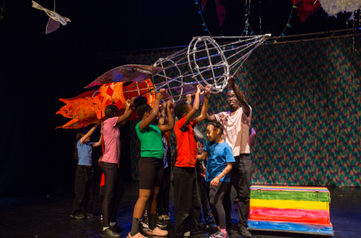 What's on in London this weekend: a group of children on stage handling a prop rocket