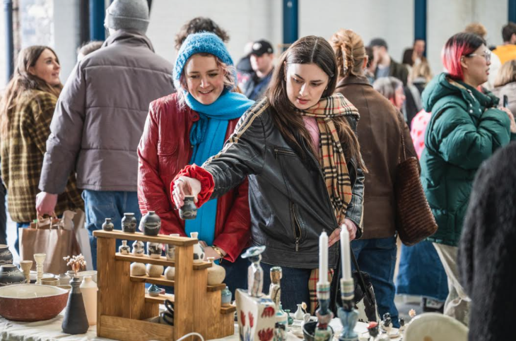 What's on in London this weekend: two people browsing a stall at a ceramics market