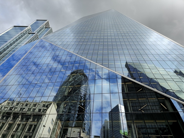 The Scalpel with other City buildings reflected in it