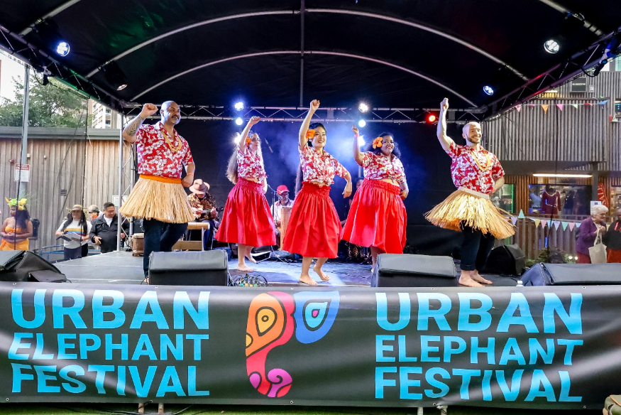 Five dancers performing on stage