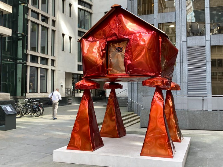 Outdoor summer events in London: a red metal house or shed on stilts on display in the City of London