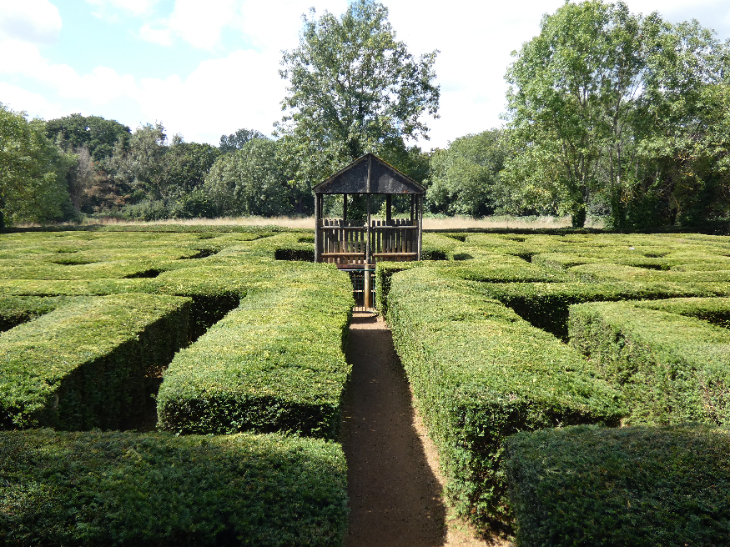 Best things to do in outer London: a raised wooden platform in the centre of a hedge maze