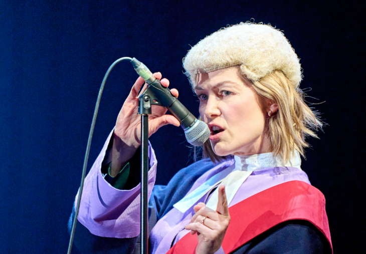 Things to do in London today: Rosamund Pike dressed as a judge, in front of a microphone
