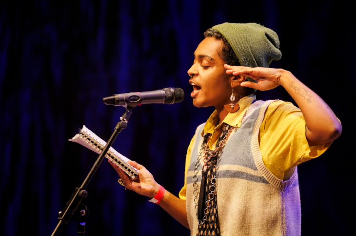 Top events in London today: a performer in front of a microphone, reading from a notebook