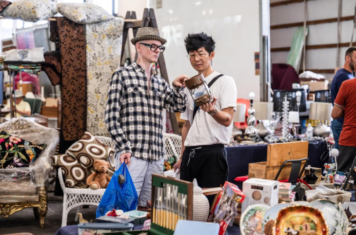 This weekend in London: two people examining a lantern at a flea market